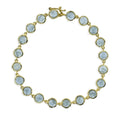 Gold bezel set light blue sapphire bracelet