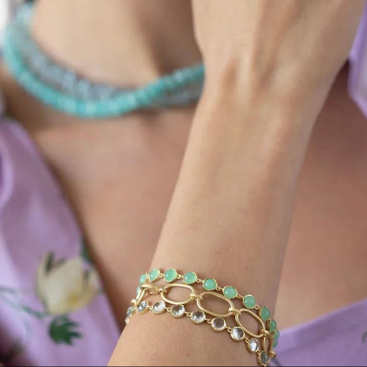 Gold bezel set light blue sapphire bracelet